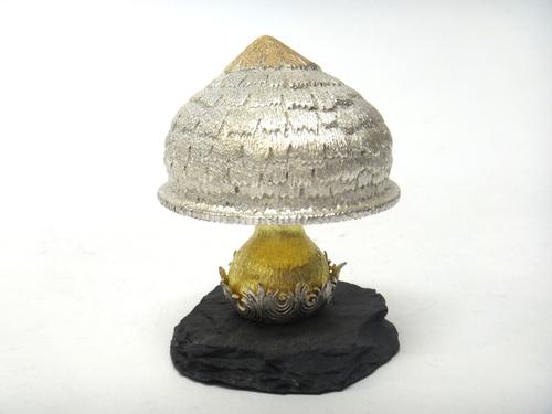 A silver and silver gilt limited edition ornamental mushroom,  Christmas Feast theme, raised on a slate base, London 1979, maker C.N. Lawrence, height