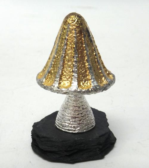 A silver and silver gilt limited edition ornamental mushroom, Wind in the Willows theme, raised on a slate base, London 1983, maker C.N. Lawrence, hei