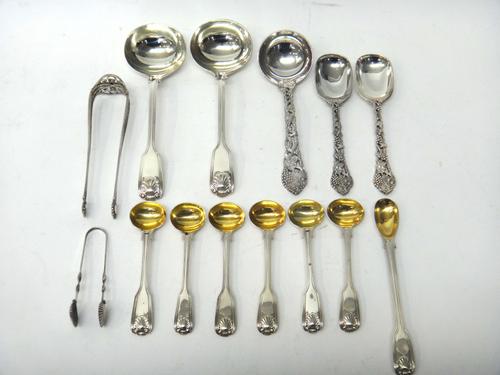 Silver, comprising; a pair of double struck fiddle, thread and shell pattern sauce ladles, London 1852, three spoons with cast handles, decorated with