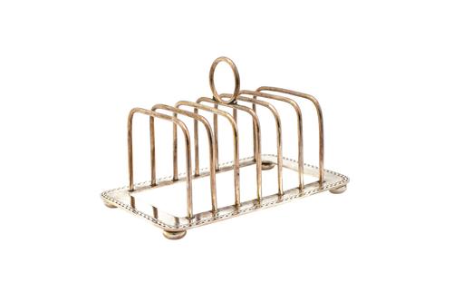 A Liberty & Co silver seven bar toastrack, having a loop shaped handle, decorated border to the base and raised on four bun feet, Birmingham 1913, wei