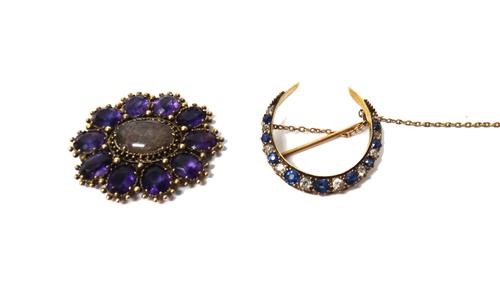 A gold, sapphire and diamond set brooch, designed as a crescent, fitted with a safety chain and a gold and amethyst set oval brooch front, glazed with