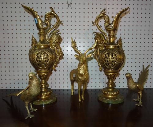 A group of metalware, including two ewers, two pheasants and one stag. (5)  Rost