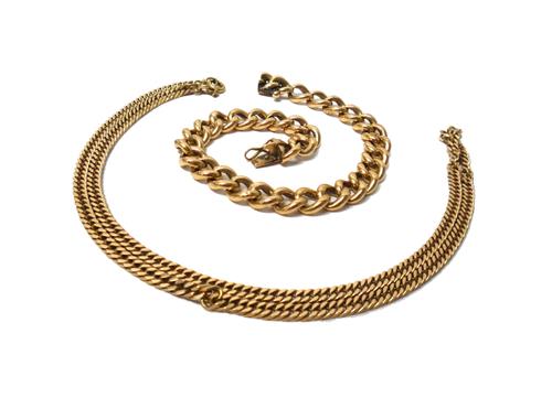 A gold hollow curb link bracelet on a snap clasp, length 21cm and a 9ct gold faceted curb link neckchain, on a boltring clasp, combined weight 37.7 gm