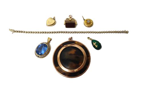 A gold mounted circular hinge lidded case, detailed 9 CT, a 9ct gold and diamond set line bracelet, a gold mounted bloodstone and cornelian set three