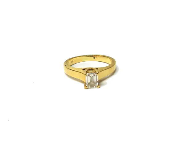 An 18ct gold diamond set solitaire ring, the claw set Millennium cut diamond weighing approximately 0.55cts, the shank stamped '62', ring size N, gros