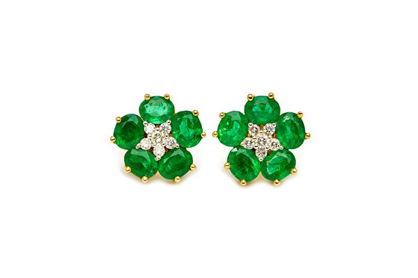A pair of 18ct gold, emerald and diamond cluster earstuds, each designed as a flowerhead, mounted with six circular cut  diamonds at the centre, in a