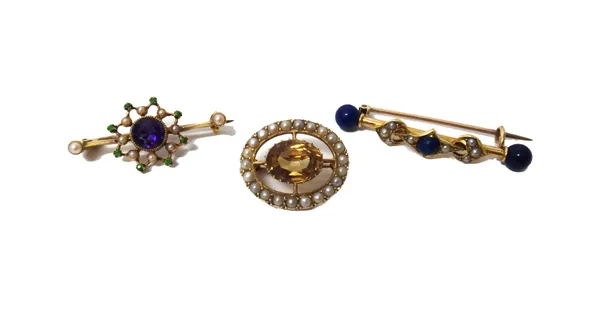 A gold, lapis lazuli and half pearl set brooch, a gold, amethyst, demantoid garnet and seed pearl set brooch and a gold brooch, claw set with an oval