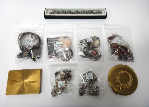 Silver and other jewellery, comprising; a reconstituted amber necklace, another necklace, two pendants with neckchains, two oval hinged bangles, eight