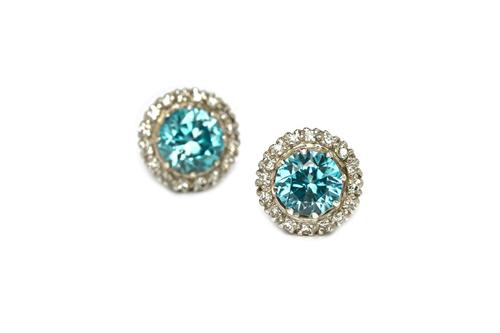 A pair of diamond and blue zircon set circular cluster earstuds, each claw set with a circular cut blue zircon at the centre, within a surround of cir