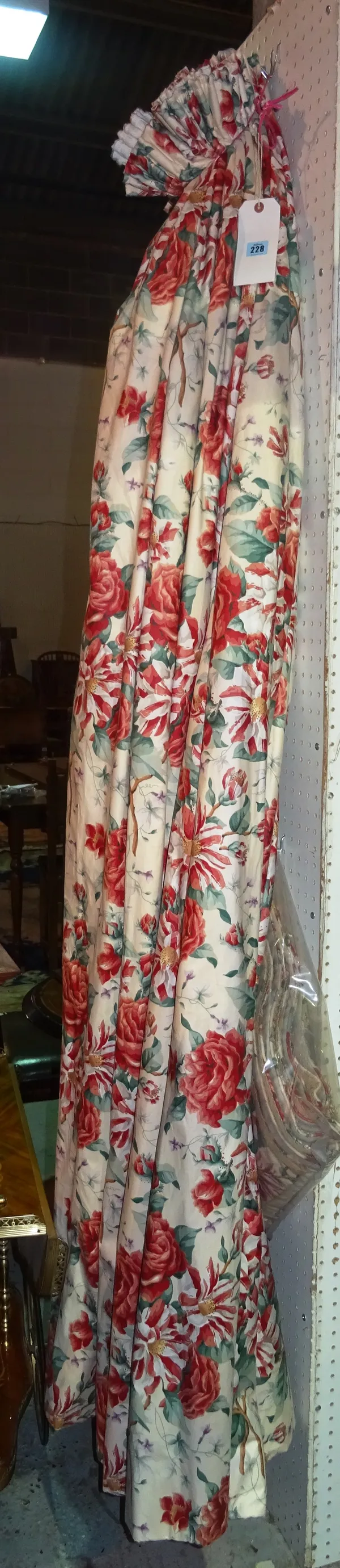 Curtains; two pairs of lined and interlined red floral curtains on beige background, each approx 110cm wide x 200cm drop, to included three pelmets. G