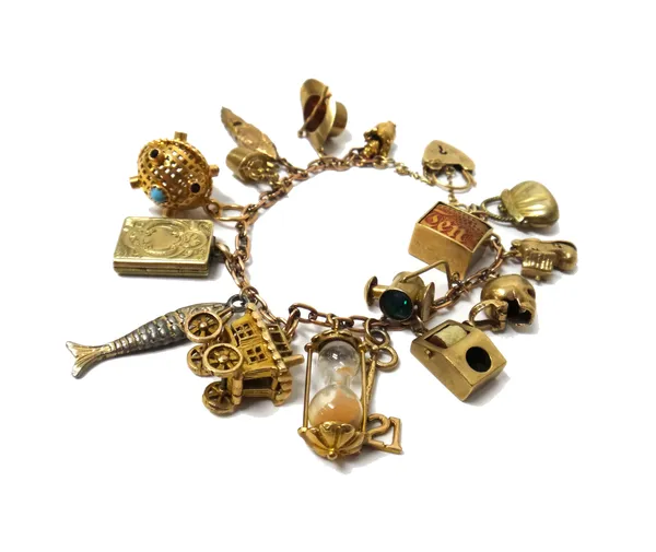 A gold oval link bracelet, with a gold heart shaped padlock clasp, detailed 9 CT, fitted with sixteen mostly 9ct gold and other charms, including; a g