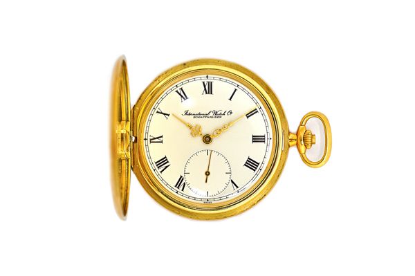 An International Watch Co 18ct gold cased, keyless wind, hunting cased dress watch, with a signed jewelled lever movement, 18ct gold inner snap case b