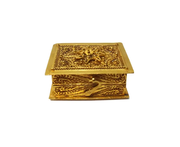A gold filigree box of rectangular form, with a folding hook and eye clasp, 4cm x 3.2cm, weight 29 gms.  Illustrated