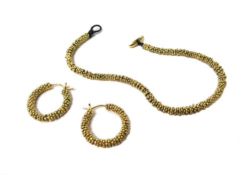 A gold and diamond set bracelet, in a beaded link design, the clasp bar mounted with a row of six graduated circular cut diamonds and a pair of 18ct g