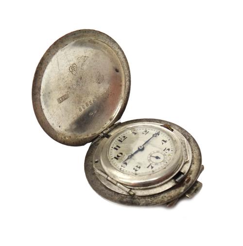 A German silver hunting cased travelling watch, with a jewelled Swiss lever movement, the unsigned silvered dial with black Arabic numerals, subsidiar
