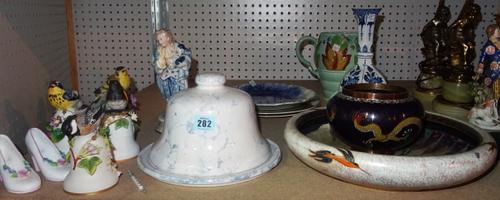 Ceramics, including; a green Clarice Cliff jug, a Delft vase, four porcelain bells, each with a small bird on top, plates and sundry. (qty) S4