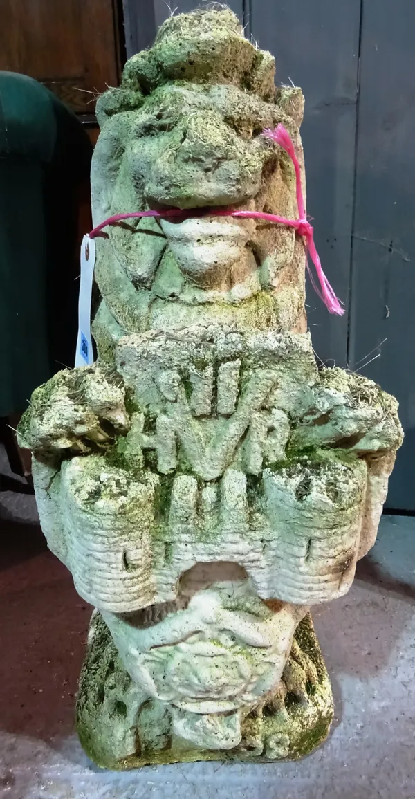 A 20th century sandstone figure depicting a lion holding a shield, 67cm high.  K6
