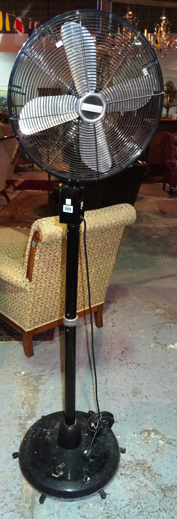A vintage 'Cinne' floor standing fan, black lacquered metal and chrome, on a circular base, 166cm high. G3