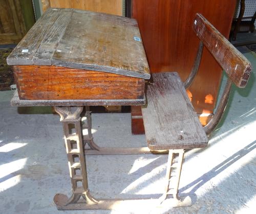 An early 20th century pine and cast iron single school desk, with chair, 56cm wide. D9