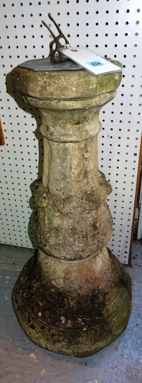 A reconstituted stone sundial with acanthus moulded column and octagonal base, 86cm high. A7