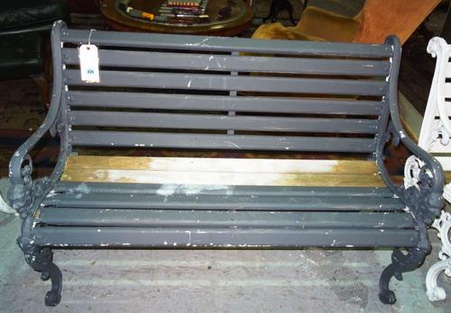 A grey painted aluminium garden bench with lion mask mount, 124cm wide, D4