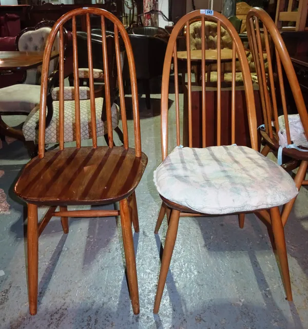 A matched set of four Ercol stick back dining chairs, (4). I3