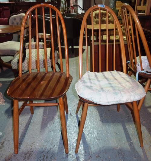 A matched set of four Ercol stick back dining chairs, (4). I3