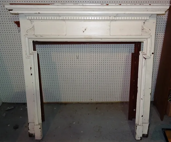 A 20th century white painted fire surround, together with a smaller pine surround, 137cm wide x 114cm high x 106cm aperture. (2) CAB