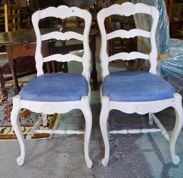A set of six 20th century white painted ladder back dining chairs, on sabre supports, (6). B9
