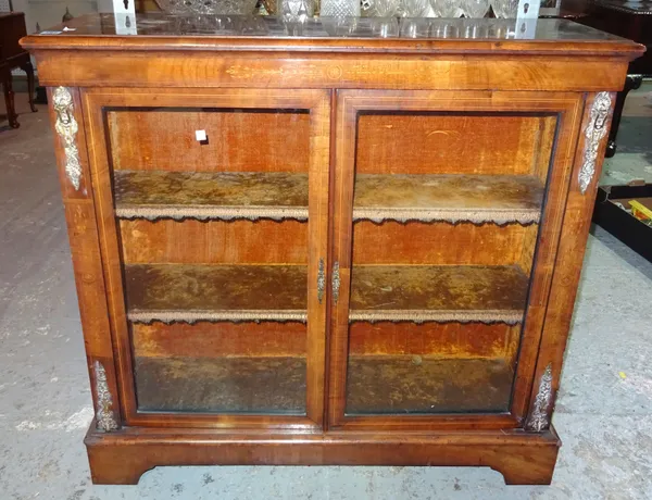 A Victorian walnut two door glazed side cabinet, with gilt metal mounts, 107cm wide. I3