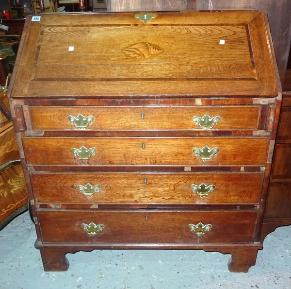 A George III oak and mahogany banded bureau, shell inlaid fall front above four long drawers, 92cm wide. I5