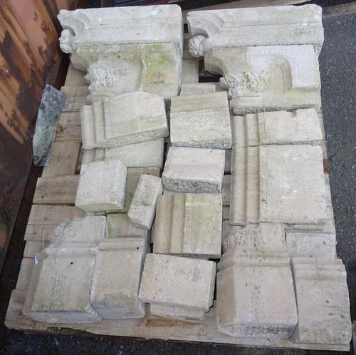 An 18th century carved stone fire surround, with cherub finials. (a.f) OUT