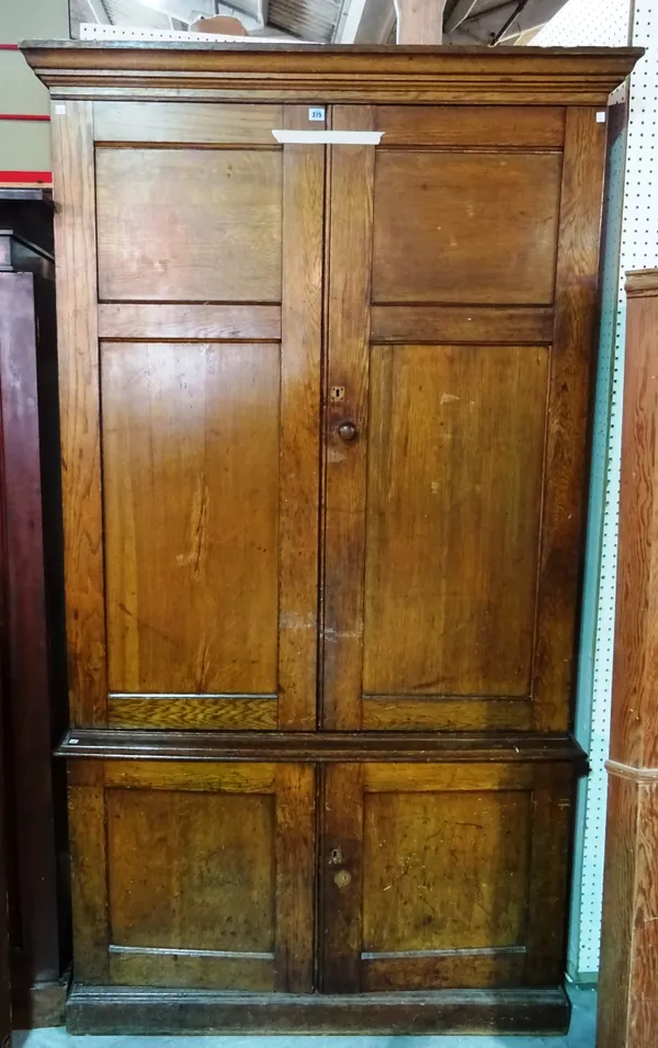 A 19th century oak estate cupboard, 124cm wide x 225cm high.  M6