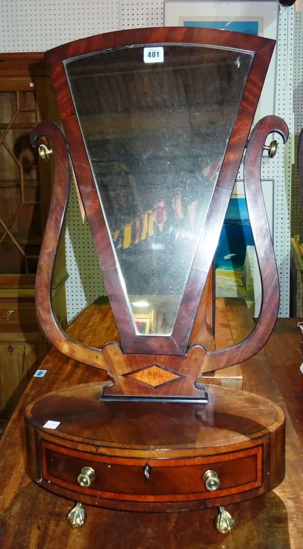 A 19th century mahogany, banded and box strung dressing table mirror of unusual tapered triangular form, with oval single drawer base on brass claw an