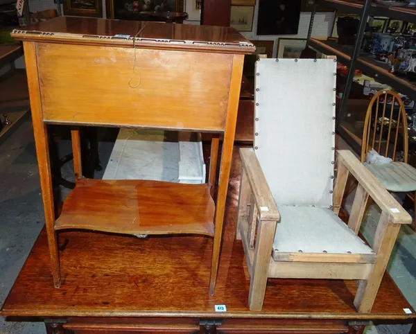 A 20th century adjustable pine child's armchair, 37.5cms wide; and an Edwardian sewing table with sliding top, (2).  K3