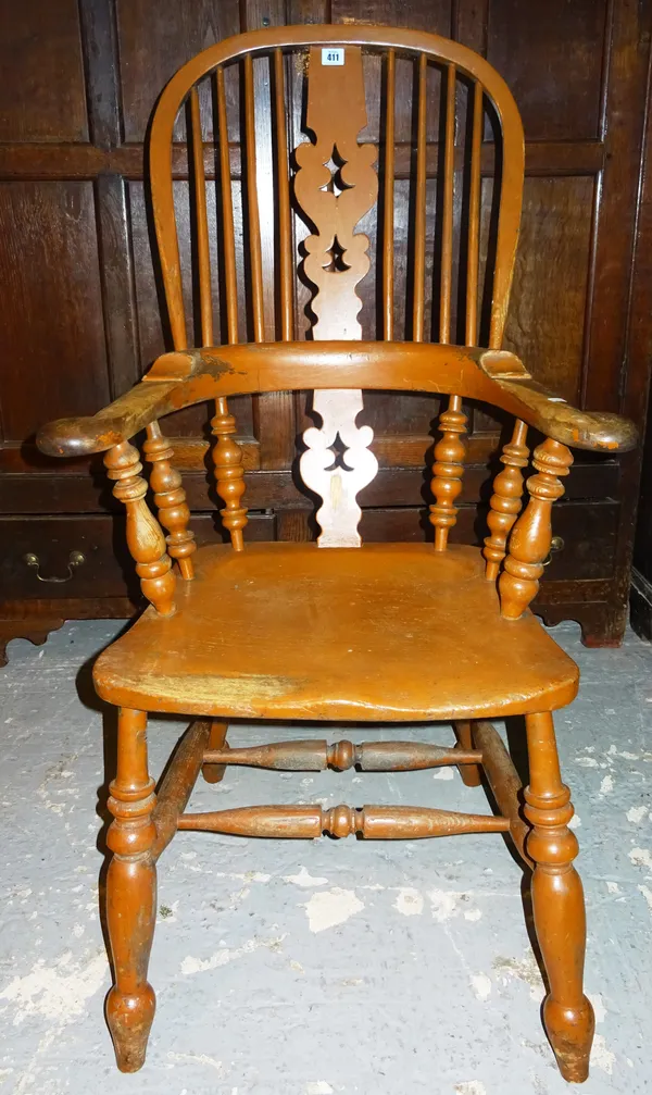 A 19th century bow back open armchair with elm seat. K9