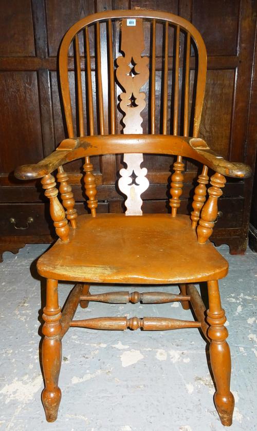 A 19th century bow back open armchair with elm seat. K9