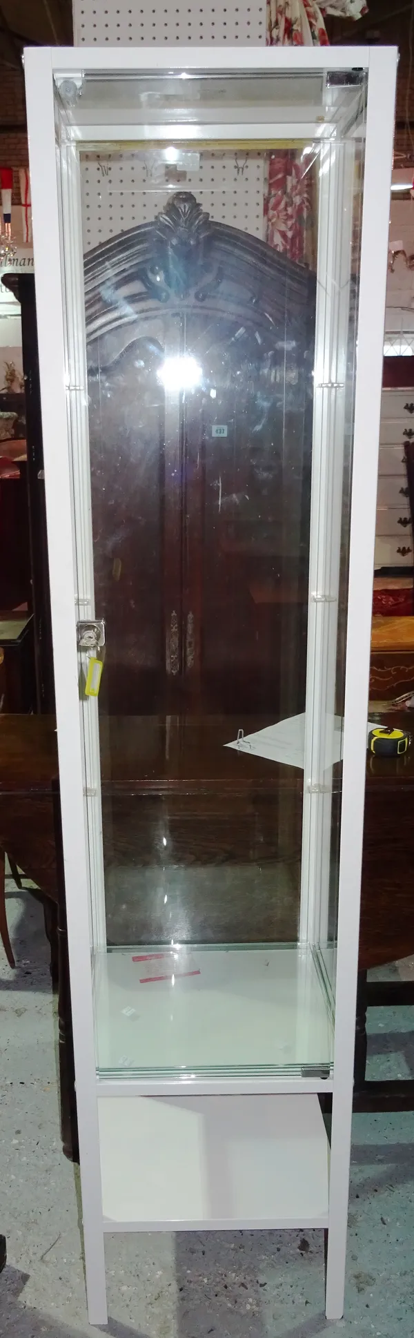 A 20th century white metal display cabinet, 40cm wide x 175cm high. J5