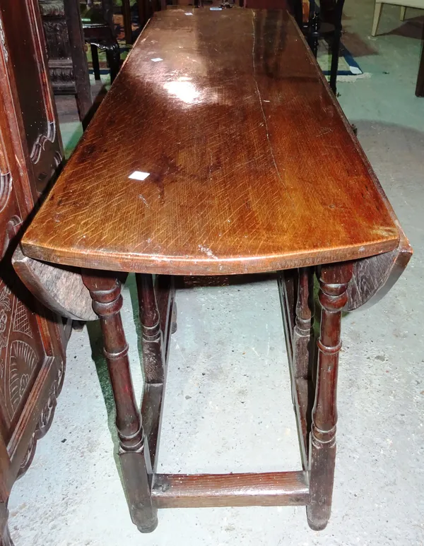 A 17th century and later oak small twin drop-leaf table, 113cm wide. K7