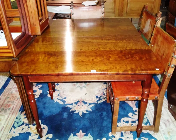 A 20th century mahogany extending dining table, with two extra leaves, on turned supports, 77cm high x 133cm long x 230cm fully extended. J6