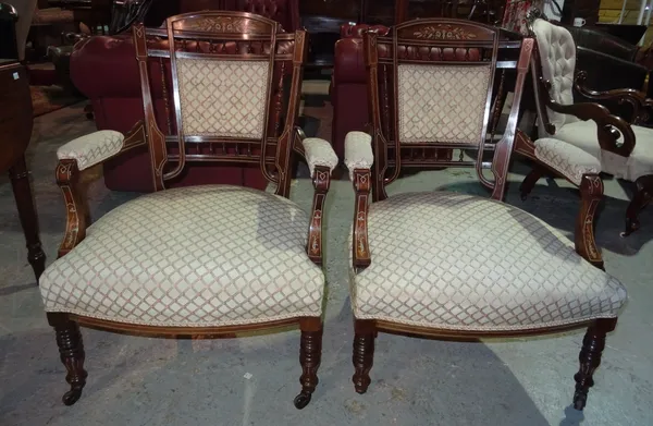 A pair of Edwardian mahogany inlaid armchairs, on ring turned supports, (2). H3