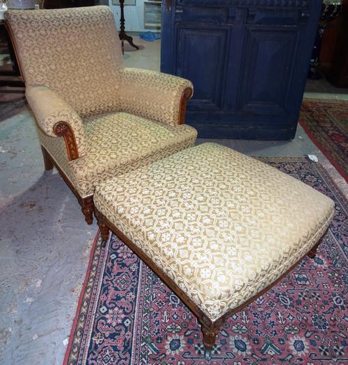 A 19th century walnut framed easy armchair, with matching footstool, (2). G3