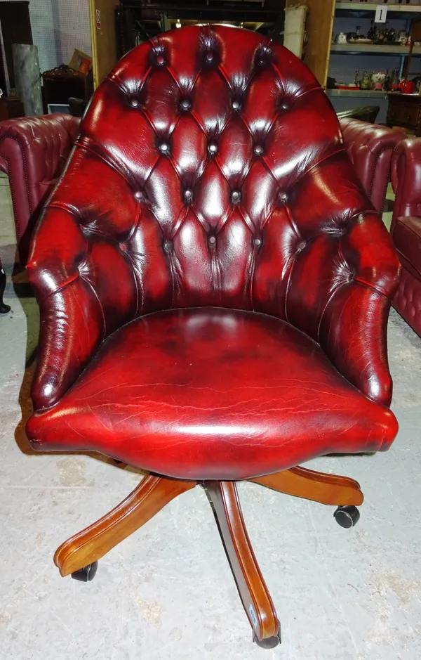 A 20th century red leather tub back desk chair. G4