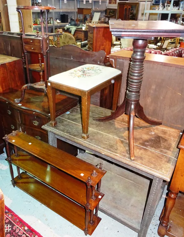 A George III mahogany wig stand, together with a mahogany three tier wall shelf, an upholstered footstool and a mahogany adjustable reading stand, (4)