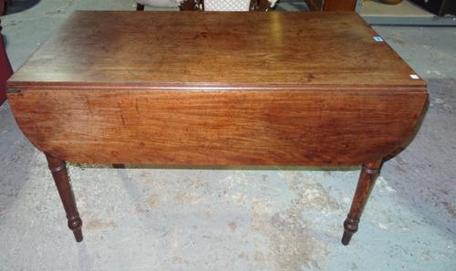 An early 19th century mahogany Pembroke table with single drawer on ring turned supports, 114cm wide x 74cm high. H3
