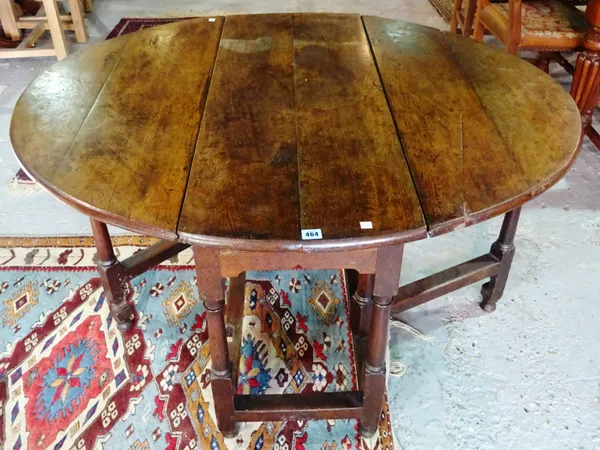 A 17th century oak drop-flap gateleg table, with single drawer, 106cm wide x 71cm high. D7