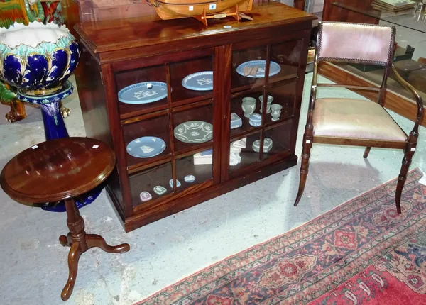 A walnut display case with glass front, a Regency style leather upholstered chair, and a mahogany occasional tripod table, 106cm wide x 93cm high, (3)