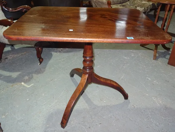 An early 19th century mahogany occasional table, the rectangular top with rounded corners, on a turned support with inswept legs, 86cms. I3