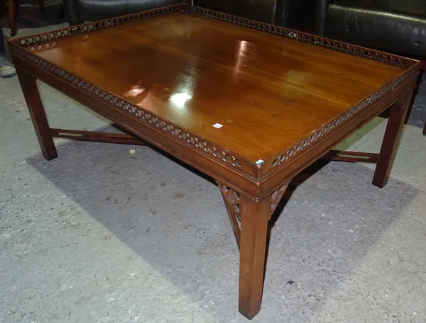 A mahogany coffee table of rectangular form, with pierced gallery, on square legs with pierced spandrels and 'X' frame stretchers, 109cm wide x 49cm h