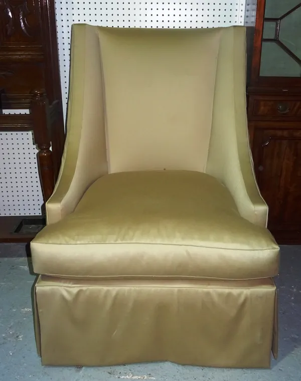 Baker Furniture Company; a 20th century high back armchair, with downswept arms on tapering block supports, 75cm wide x 103cm high. I11